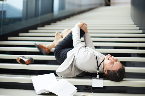 Business lady falling down stairs due to Negligence