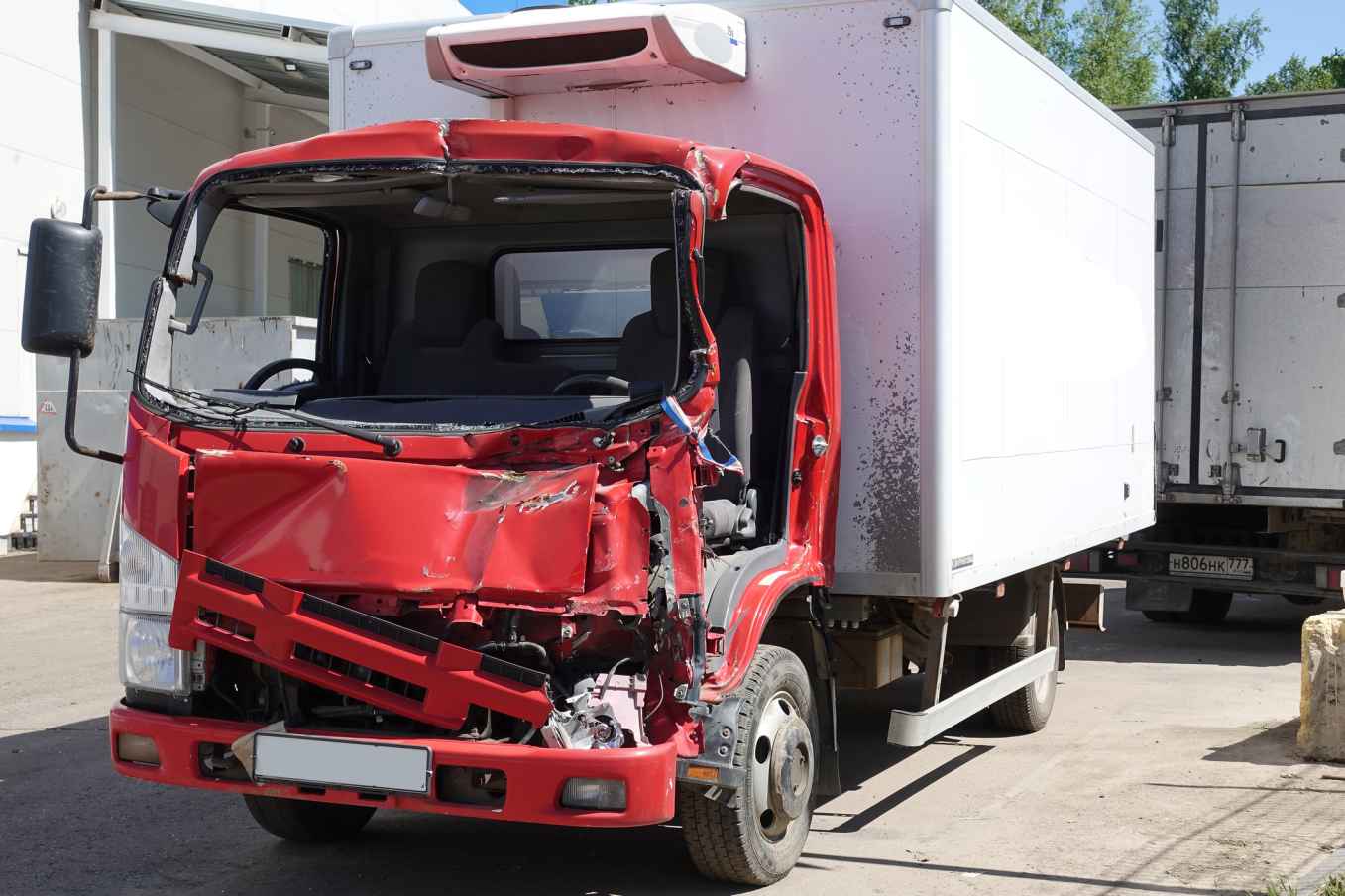 A damaged truck in a parking lot after an accident in Apollo Beach, FL.
